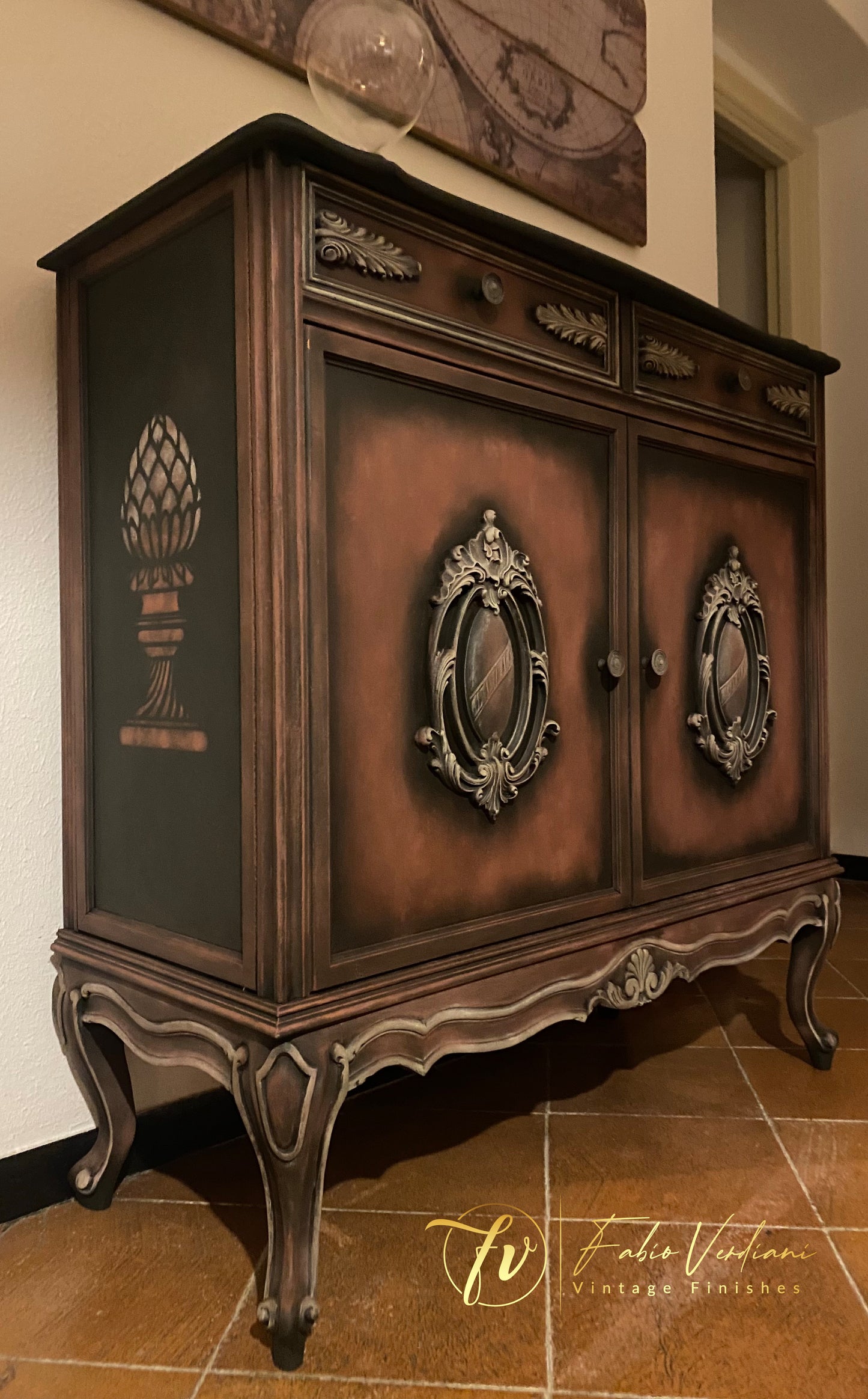 Small cabinet with a base of Annie Sloan Graphite, dry brushing in Primer Red and details in Versailles Yellow. Stencils on each side, clear  and black wax.