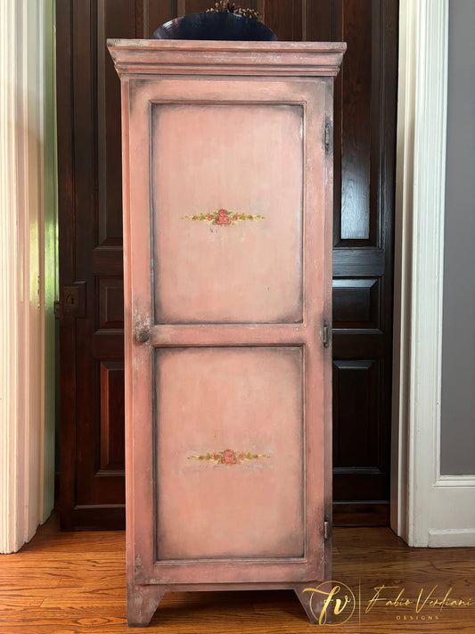 Recreating the illusion of old world finishes on this pine broom closet. Base of Annie Sloan Paris Gray, Homestead House Dusty Rose milk paint and IOD paint inlay Petite Fleur. Clear and Dark Wax.