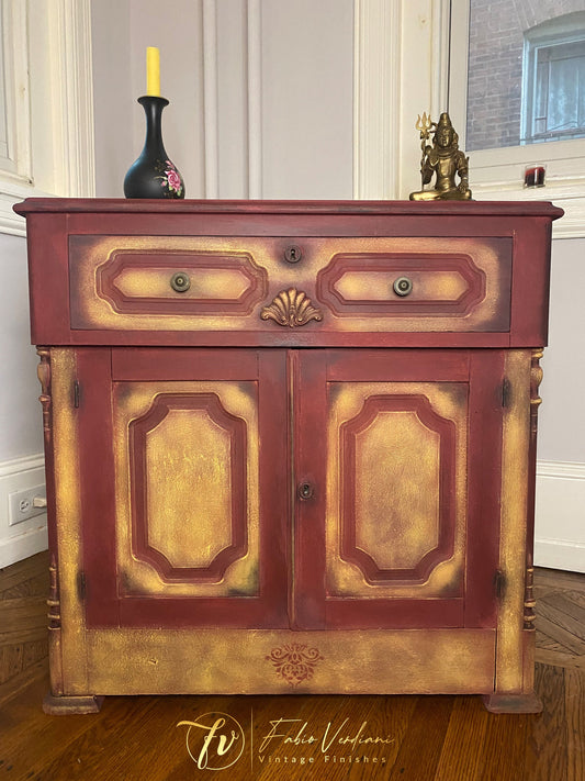 Small vintage cabinet in  Burgundy Chalk Paint, dry brushing in Yellow and some shades of Graphite.